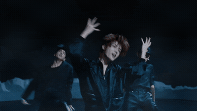 Group Of People Dancing In The Dark GIF