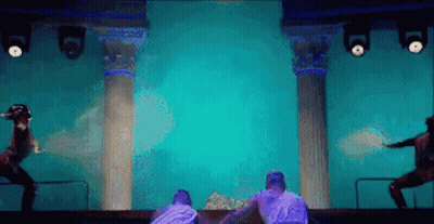 Group Of People Dancing On Blue Stage GIF