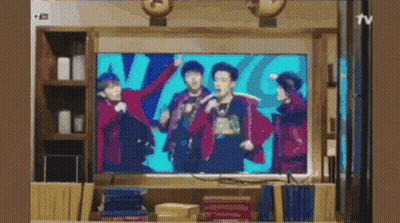 Group Of People Dancing On TV Screen GIF