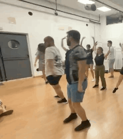 Group Of People Dancing Together GIF