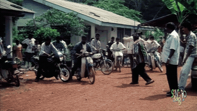 Group Of People Gathered In Dirt Area Saying Sunday GIF