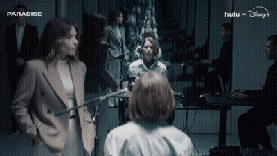 Group Of People Gathered In Room Saying Paradise GIF