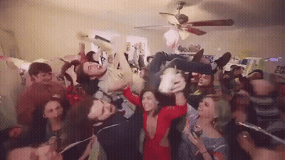 Group Of People Having A Party In Living Room GIF