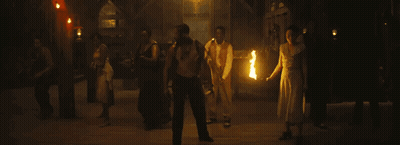 Group Of People Holding Fire Torches GIF