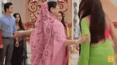Group Of People Holding Hands In A Room GIF