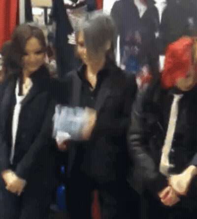 Group Of People Holding Hands In Room GIF