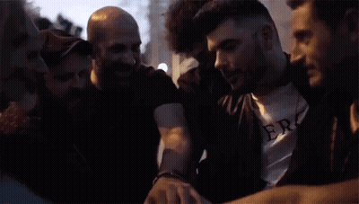 Group Of People In A Huddle GIF