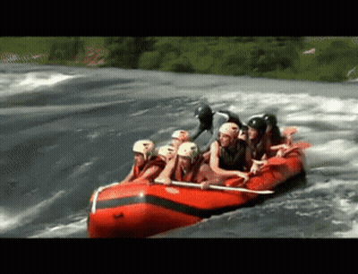 Group Of People In A Raft On A River GIF