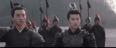 Group Of People In Armor In Front Of Building With Chinese Writing GIF