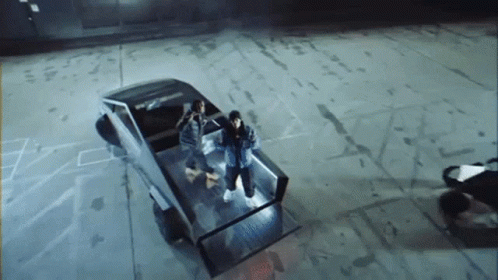Group Of People In Back Of Tesla Truck GIF