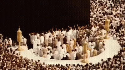 Group Of People In Circle In Front Of Mosque GIF