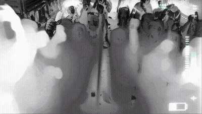 Group Of People In Dark Room With Battery Icon GIF