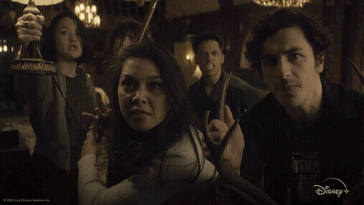 Group Of People In Dark Room With Disney+ Logo GIF