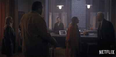 Group Of People In Dark Room With Netflix Logo GIF