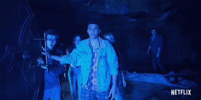 Group Of People In Dark Room With Netflix Logo GIF