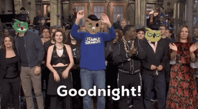 Group of People in Front of Building Saying Goodnight