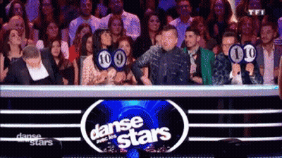 Group Of People In Front Of Dance Stars Sign GIF