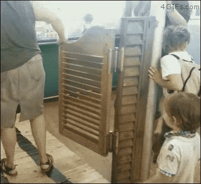 Group Of People In Front Of Open Wooden Door GIF