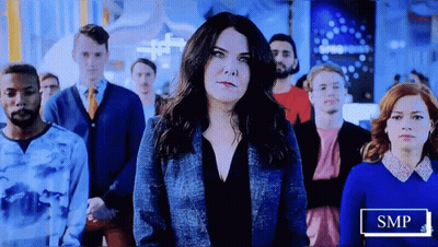 Group Of People In Front Of SMP Sign GIF