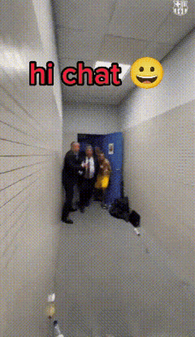 Group Of People In Hallway With Smiley Face Saying Hi Chat GIF