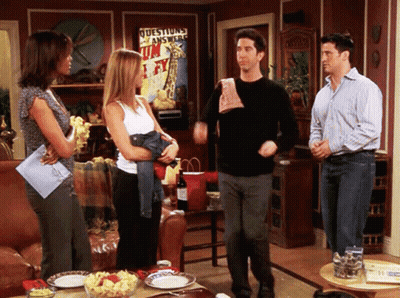 Group Of People In Living Room With Questions Answered Poster GIF