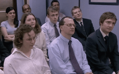 Group Of People In Suits Sitting In A Row GIF