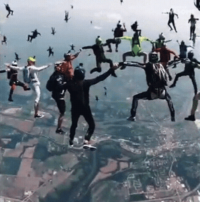 Group Of People Jumping Out Of Plane Saying Awesome GIF