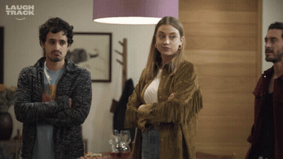 Group Of People Laughing In Room GIF