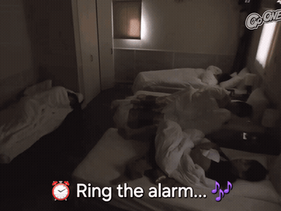Group Of People Laying On Bed Ring The Alarm GIF