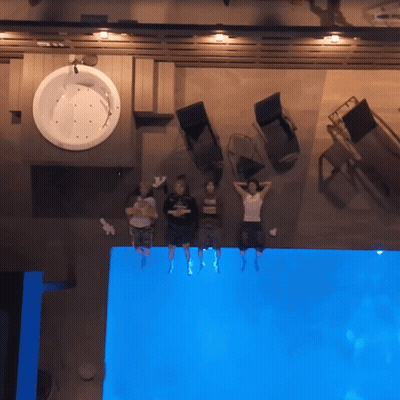 Group Of People Laying On Pool Edge GIF