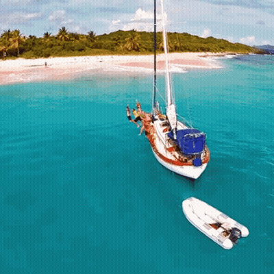 Group Of People On A Boat In The Ocean GIF