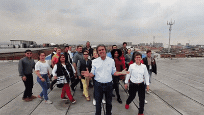 Group Of People On Roof One Man Thumbs Up GIF