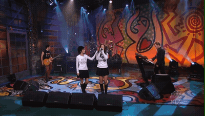 Group Of People On Stage With NBC Logo GIF