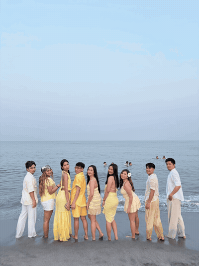 Group Of People Posing On Sandy Beach GIF