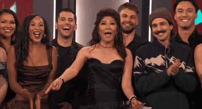 Group Of People Posing With Woman Pointing GIF
