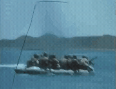Group Of People Riding In A Boat On The Ocean GIF