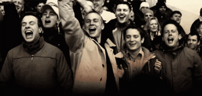 Group Of People Screaming And Laughing In Crowd GIF
