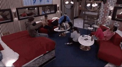 Group Of People Sitting Around Table GIF