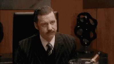 Group Of People Sitting Around Table Having Meeting GIF