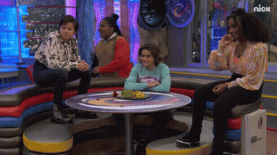 Group Of People Sitting Around Table With Nick Logo GIF