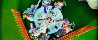 Group Of People Sitting Around Table With Plates Of Food GIF