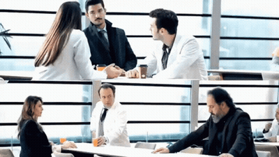 Group Of People Sitting At Table Talking GIF