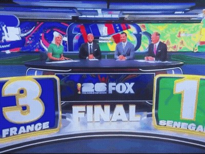 Group Of People Sitting At Table With Fox GIF