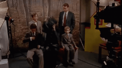 Group Of People Sitting In Front Of Camera In Room GIF