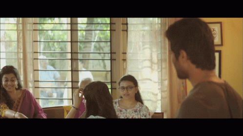 Group Of People Sitting In Front Of Window Talking GIF
