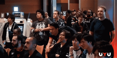 Group Of People Sitting In Room With Uyu GIF