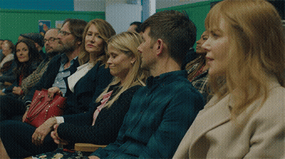 Group Of People Sitting In Waiting Room With Green Wall GIF