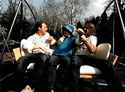 Group Of People Sitting On Swing Talking GIF