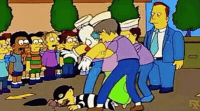 Group Of People Standing Around Clown GIF