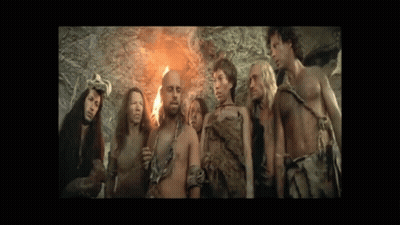 Group Of People Standing Around Fire GIF